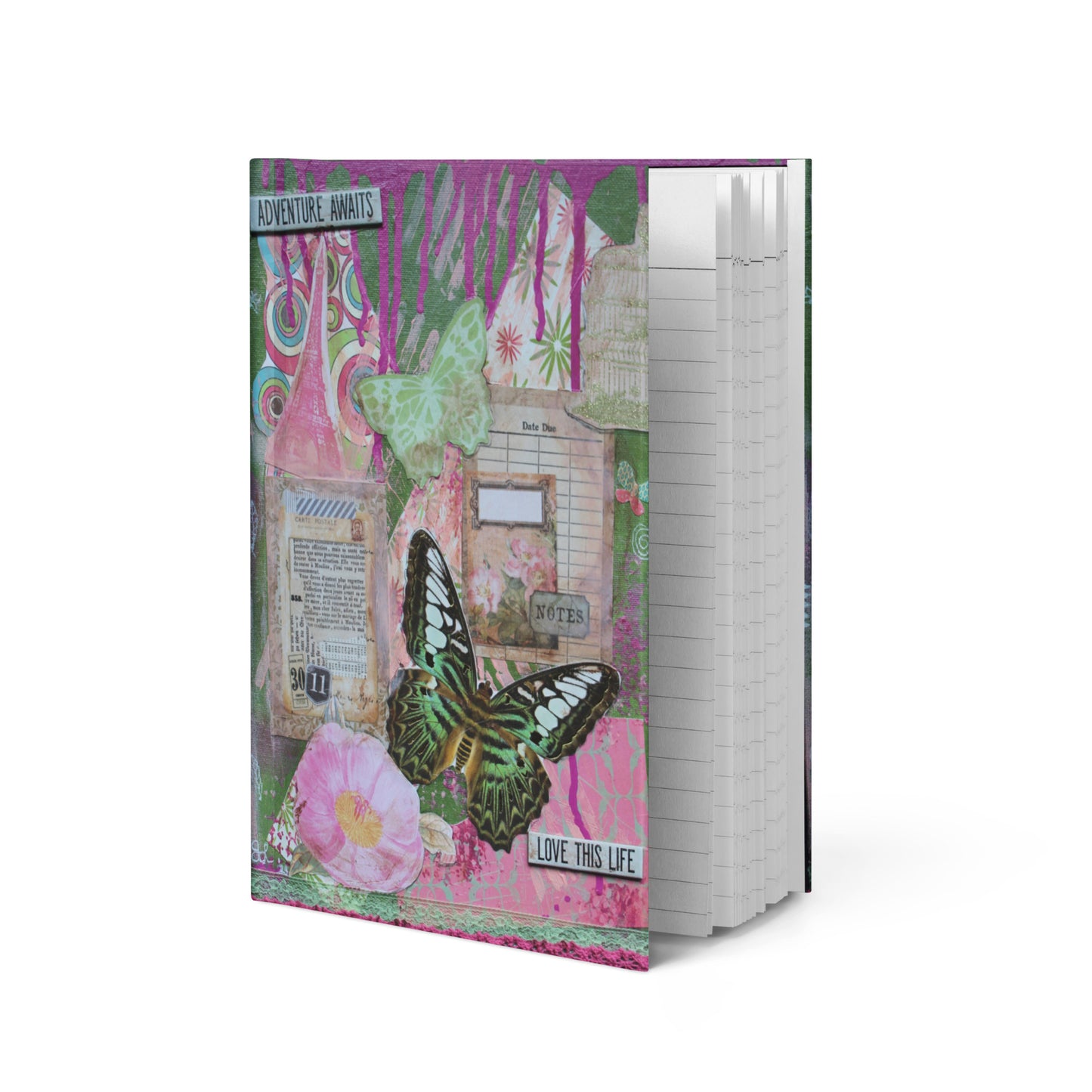 travel journal with pink and green collage art, shown upright with the lined pages inside visable.