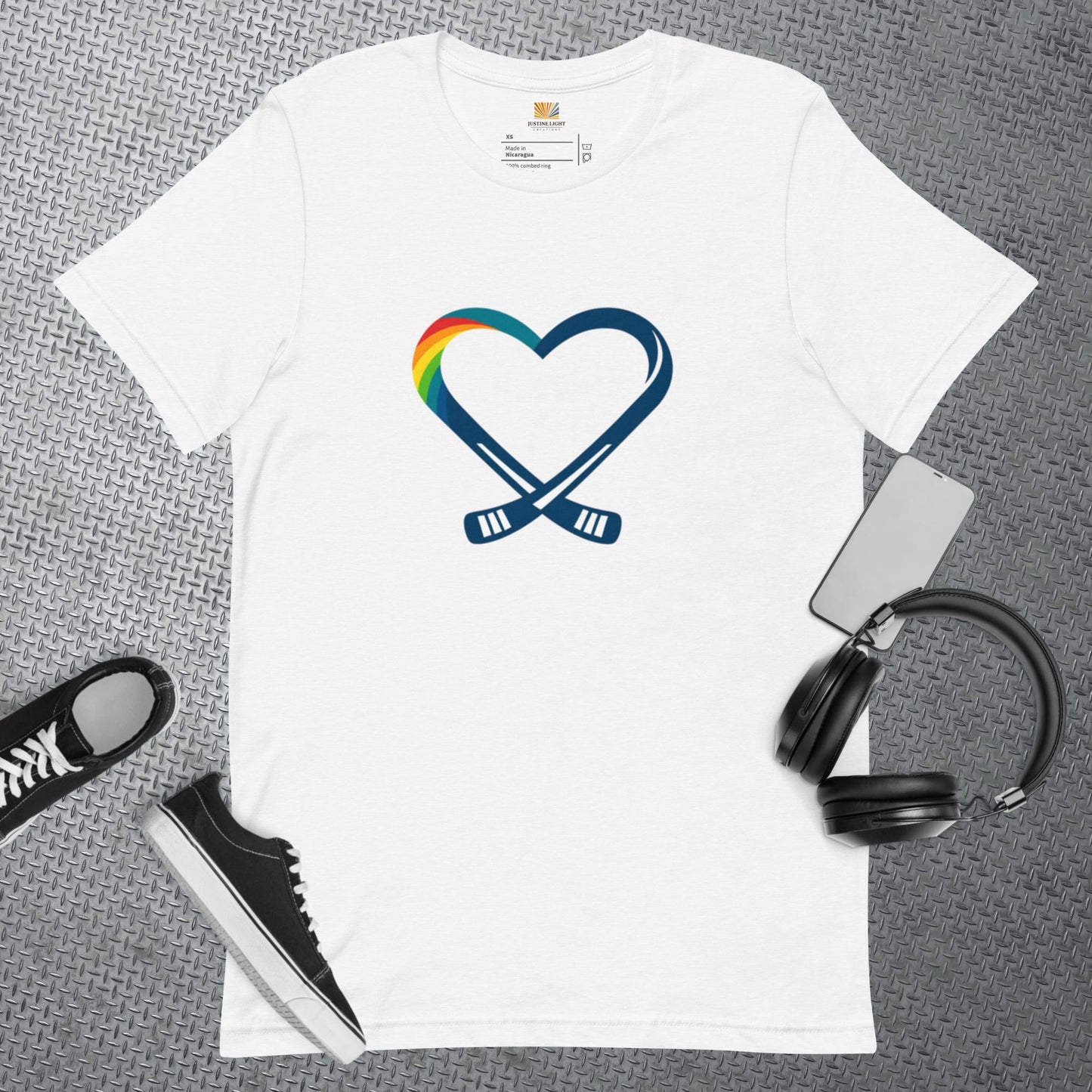 White T-shirt flat with a hockey rainbow heart logo on it.