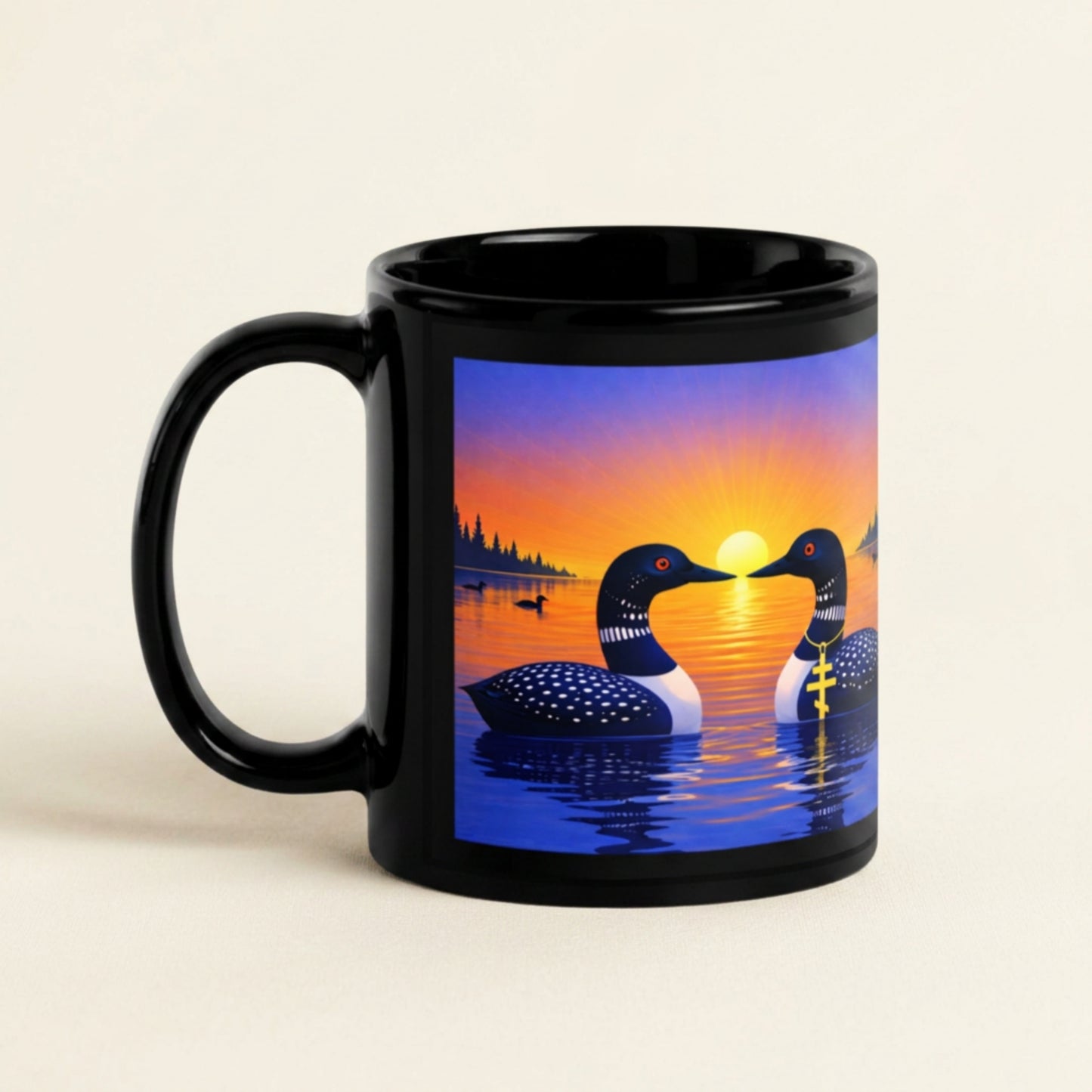 Black mug with sunrise loon design.