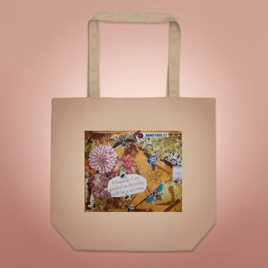 bee eco tote with honey bee art and floral design and text on a pink background