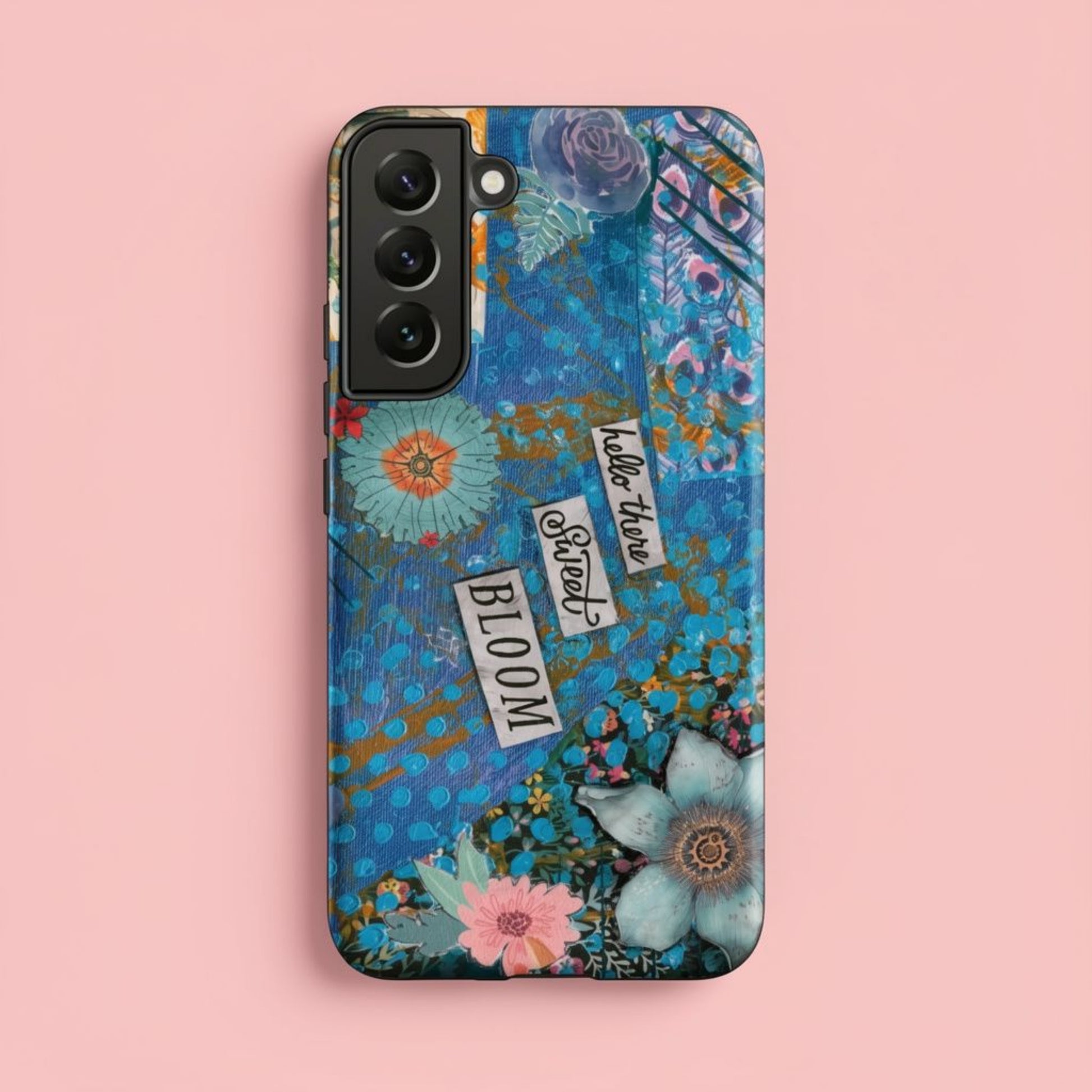 Front image of the blue and pink floral Samsung case with peacock feather layers and a quote.
