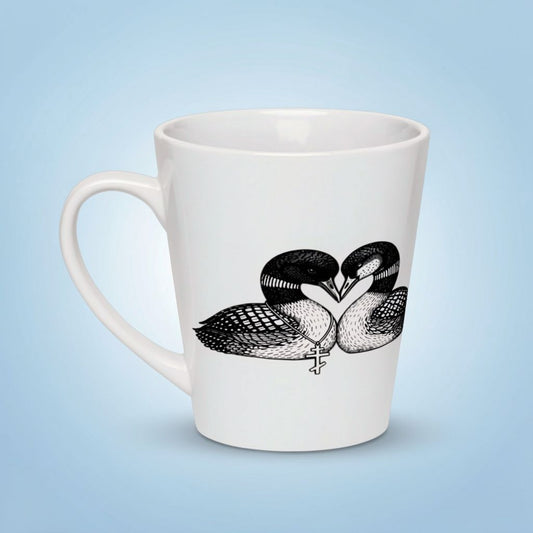 White ceramic latte mug with black and white loons forming a heart shape