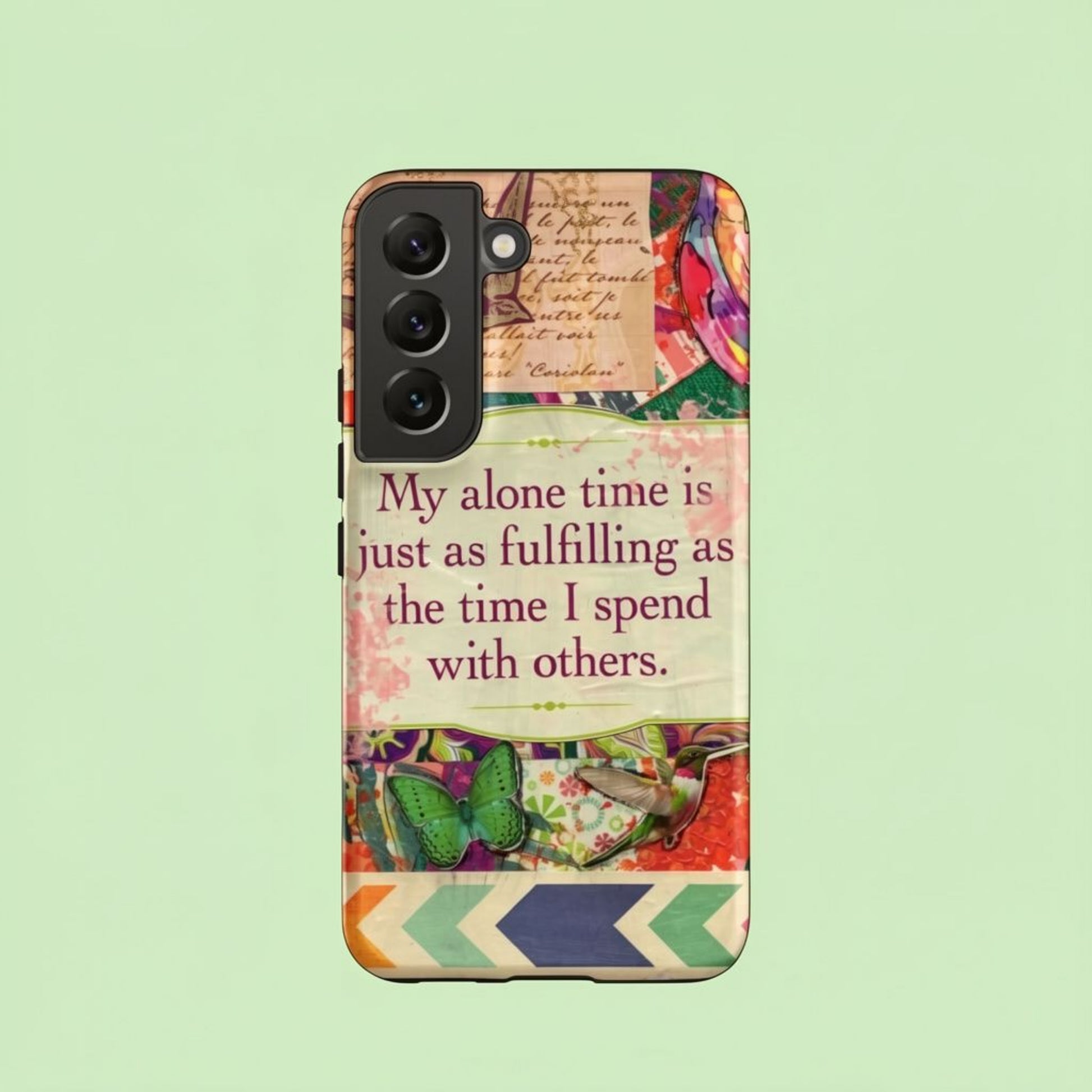 Phone case with colorful design and motivational quote on a light green background