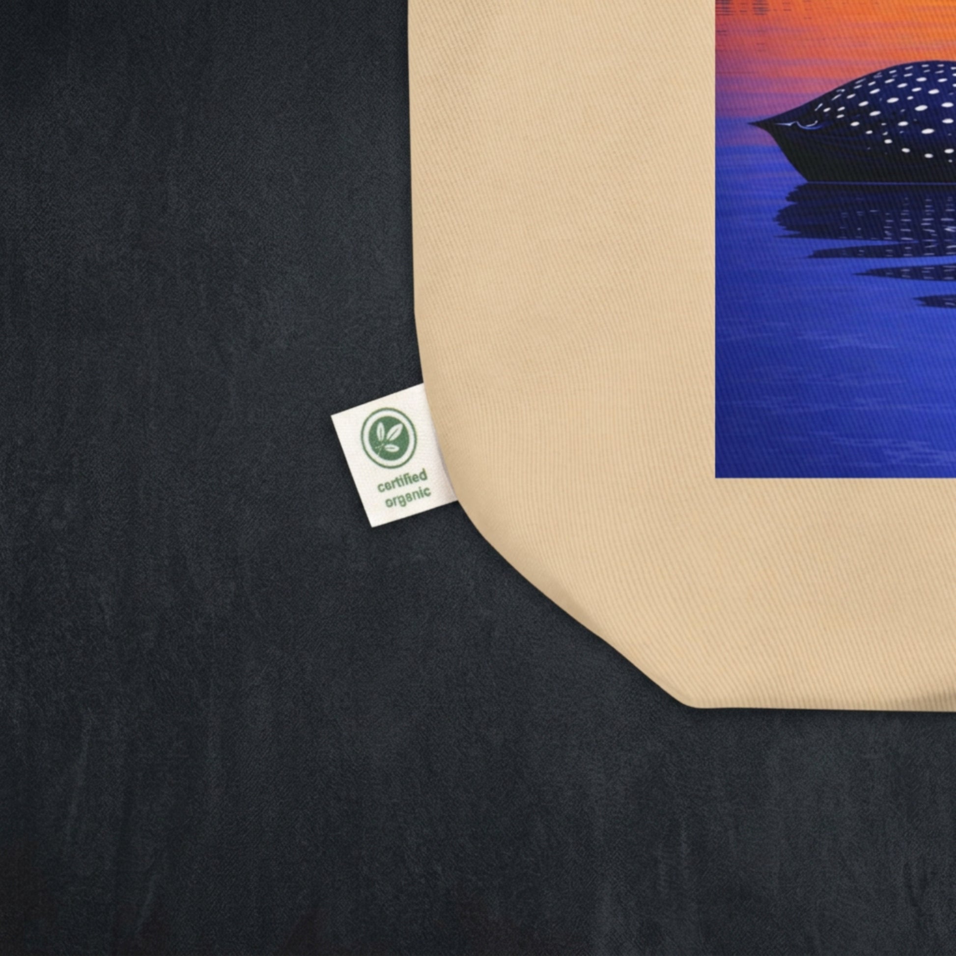 Close-up of corner of tote bag with label showing that says certified organic.