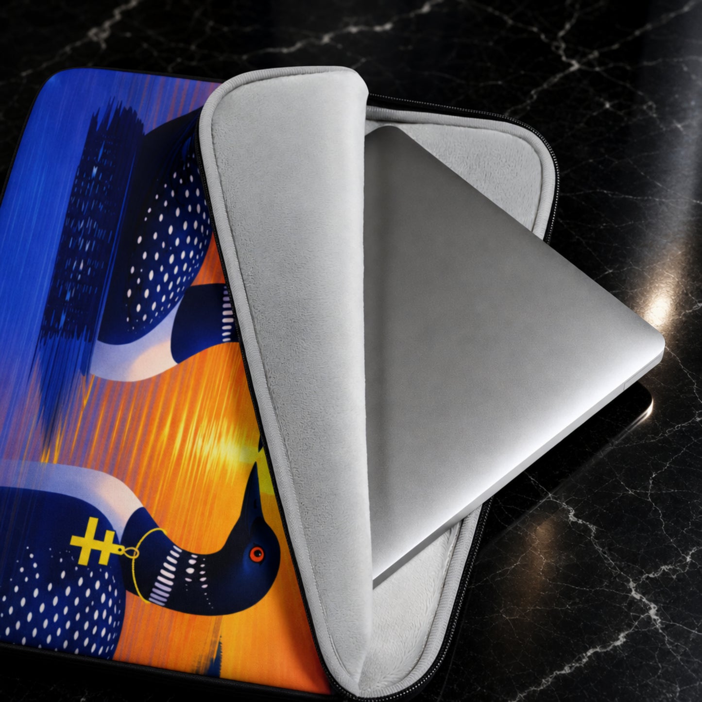 water resistant laptop sleeve with colorful loon artwork, sleeve is open to display the faux fur lined inside of the sleeve.