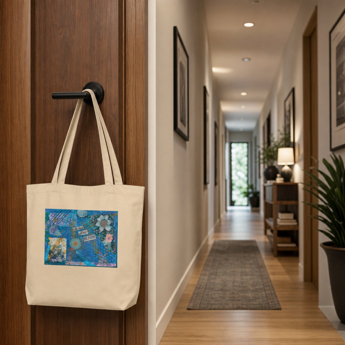 The purple floral eco tote bag is
hanging on a wooden door in a hallway.