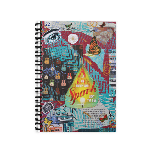 Lined notebook with mixed media artwork on it.