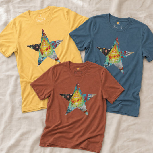 Three Star tee shirts with a colorful mixed-media star design and the words spark of inspiration on a soft unisex t shirt.
