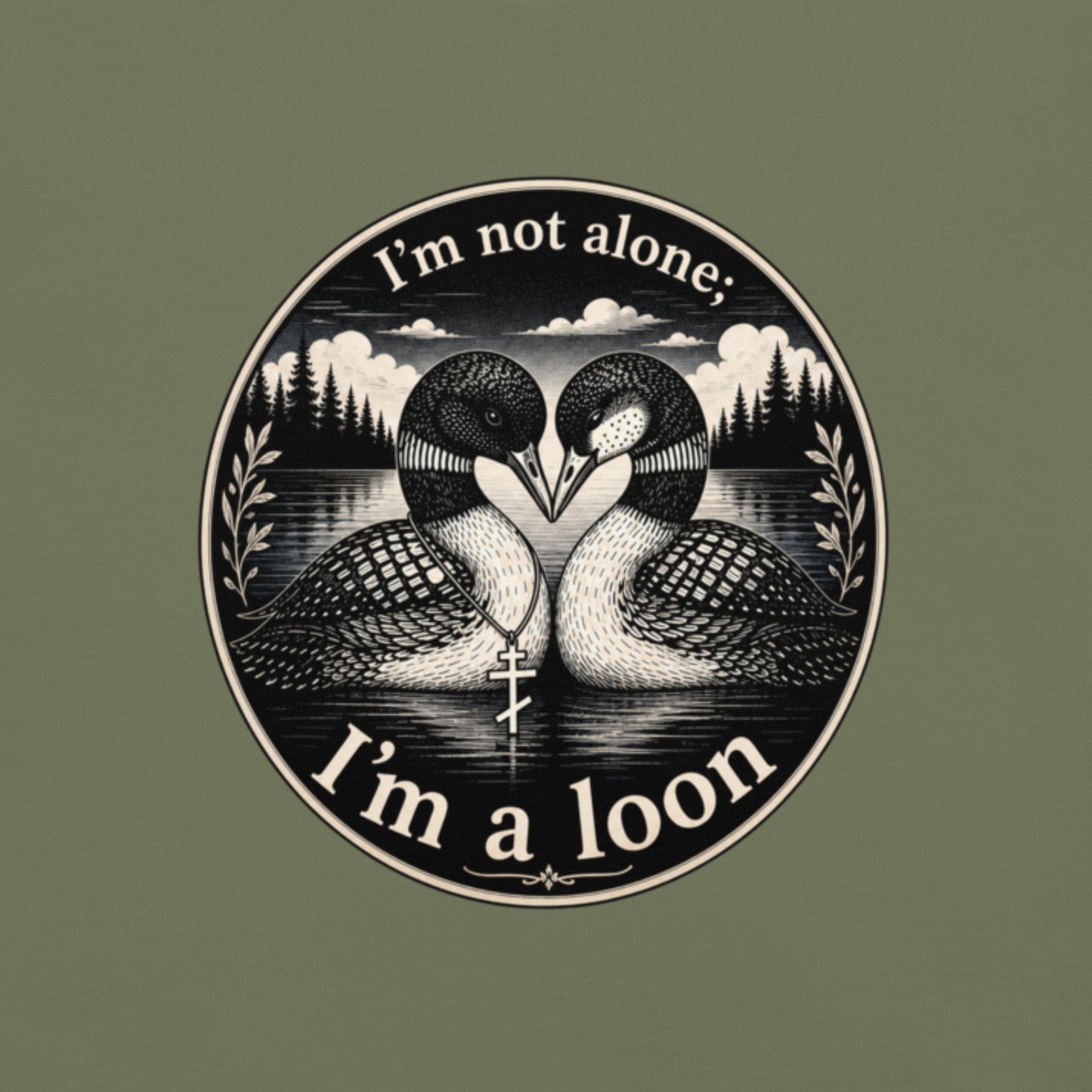 The main t-shirt image which has a circular black and white graphic print featuring two loons facing each other in front of a forest and clouds, with the text 'I'm not alone: I'm a loon' on a moss green comfort colors shirt.