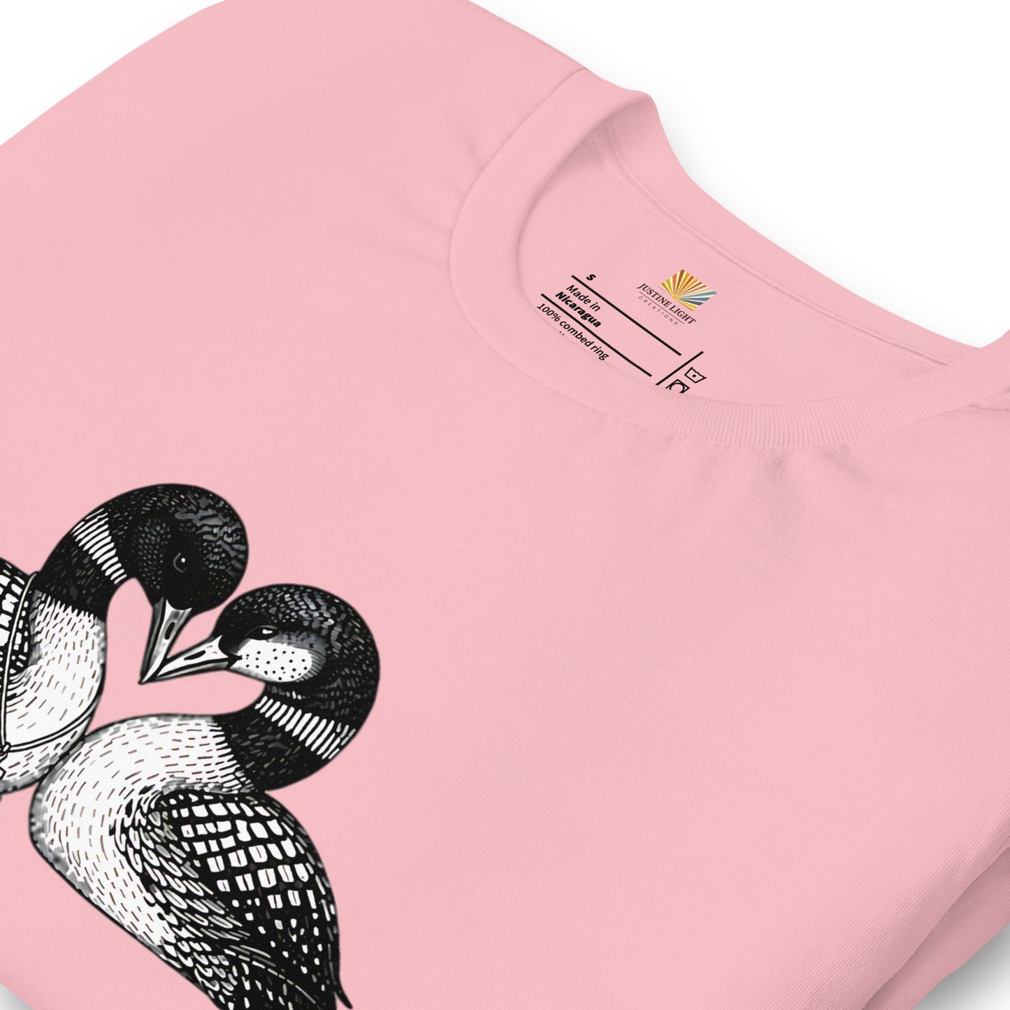 close view of crew style collar on hockey romance loon t-shirt, showing inside label. Pink colored shirt