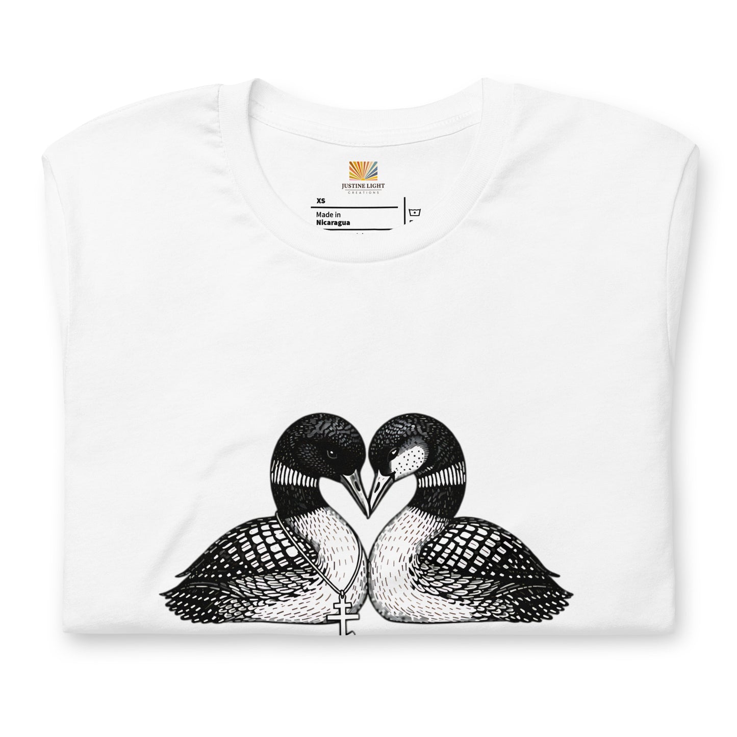 Folded image of hockey romance loon t-shirt with a graphic of two birds, with beaks together forming a heart. White color shirt