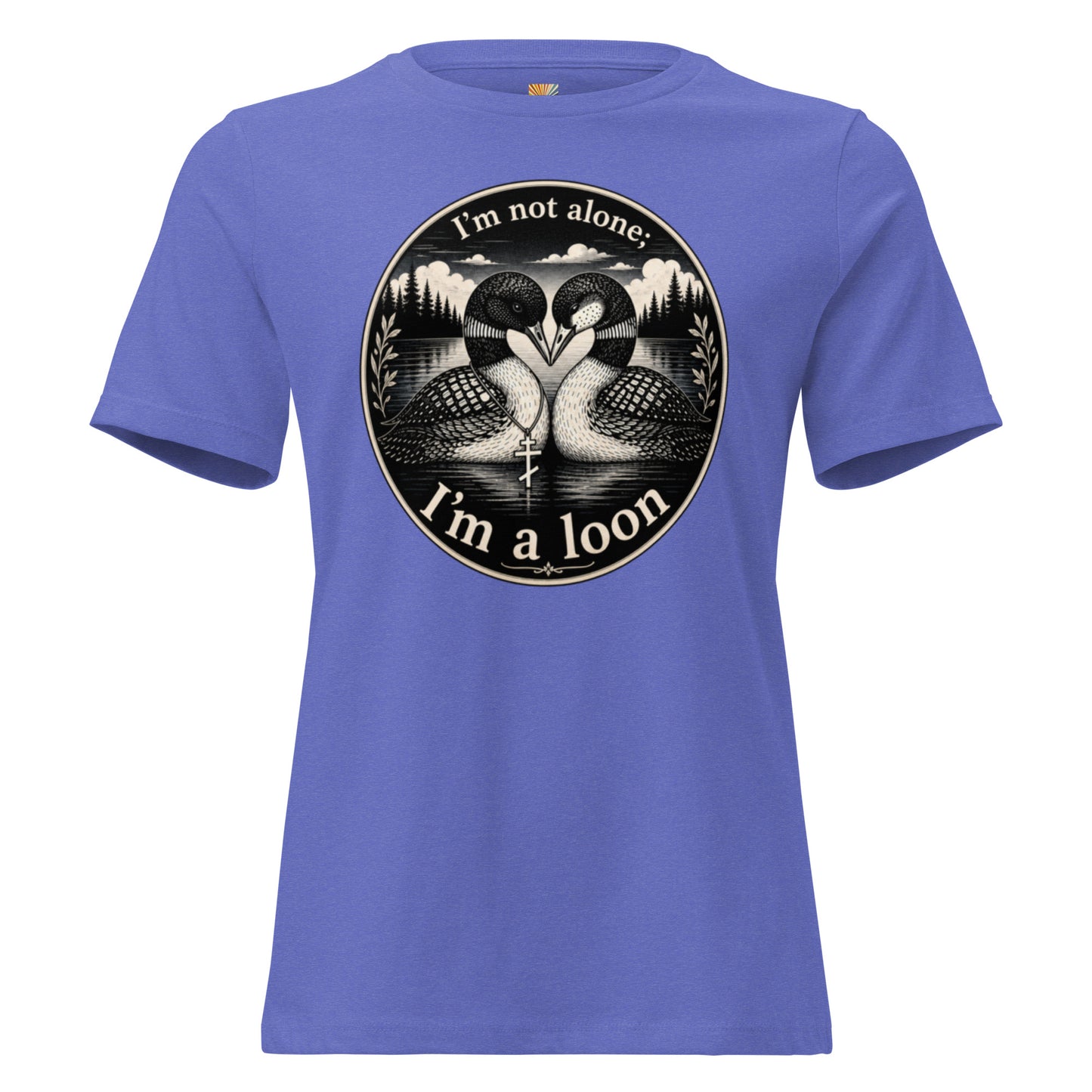 A graphic tee for women in true royal blue, short-sleeved crewneck featuring a circular black and white graphic print of two loons facing each other, with the text 'I'm not alone; I'm a loon' arched above and below the illustration.